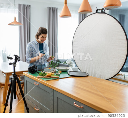 food photographer with camera working in kitchen food photographer with camera working in kitchen 90524923
