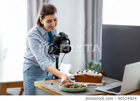 food photographer with camera working in kitchen food photographer with camera working in kitchen 90524924
