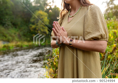woman or witch performing magic ritual on river woman or witch performing magic ritual on river 90524994
