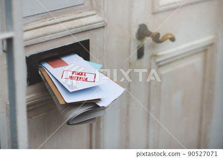 This is your final notice. Cropped shot of letters in a letter box. 90527071
