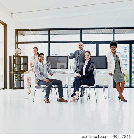 Teamwork brings out the best in each team member. Portrait of a group of businesspeople standing together. 90527846