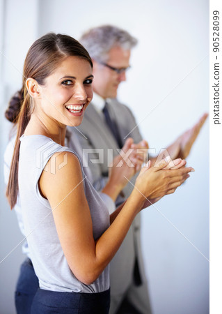 Well done. Attractive businesswoman applauding her colleagues - portrait. Well done. Attractive businesswoman applauding her colleagues - portrait. 90528099