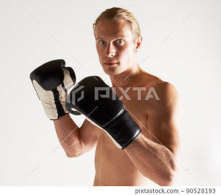 Hes the next big name in boxing. Portrait of a handsome young male boxer. Hes the next big name in boxing. Portrait of a handsome young male boxer. 90528193