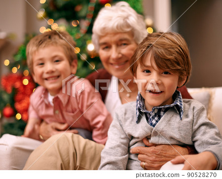 Christmas is a time for family. Shot of a family enjoying themselves at Christmas. 90528270