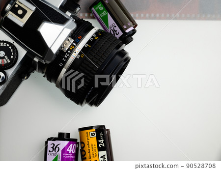 Silver halide camera and negative film white background old camera Silver halide camera and negative film white background old camera 90528708