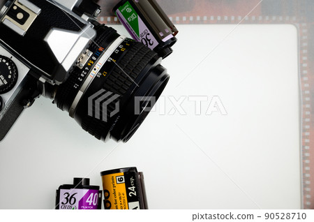 Silver halide camera and negative film white background old camera Silver halide camera and negative film white background old camera 90528710