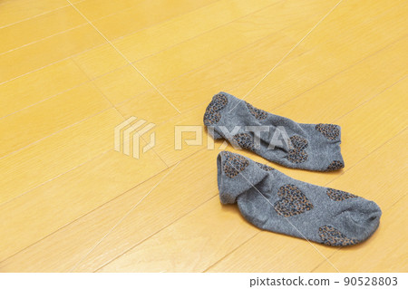 Socks abandoned in the living room 90528803