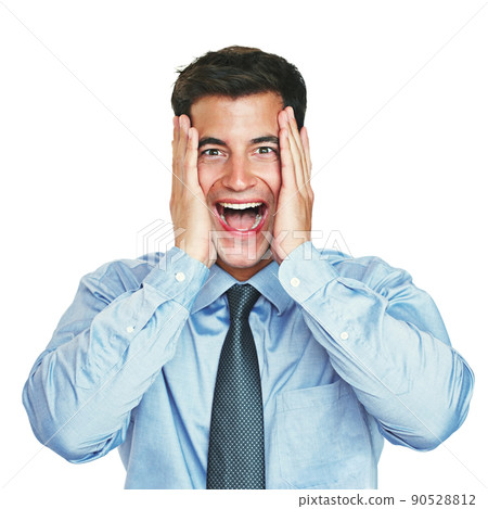 Expressing himself in the business world. Studio portrait of a young businessman looking surprised against a white background. Expressing himself in the business world. Studio portrait of a young businessman looking surprised against a white background. 90528812