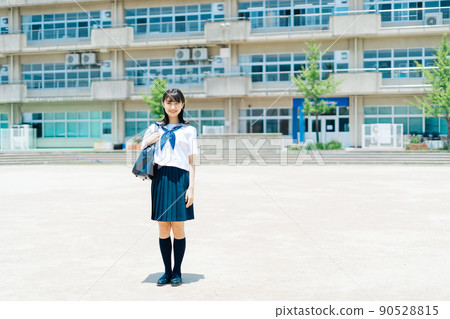 High school student standing in the school playground High school student standing in the school playground 90528815