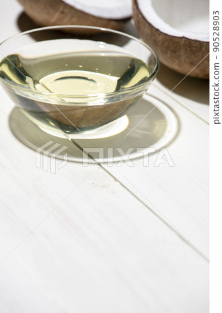 Endosperm and coconut oil visible from cracked coconut Endosperm and coconut oil visible from cracked coconut 90528903
