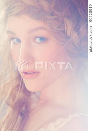 Old-fashioned glamour. Portrait of a pretty model with a plait in her hair. Old-fashioned glamour. Portrait of a pretty model with a plait in her hair. 90528919