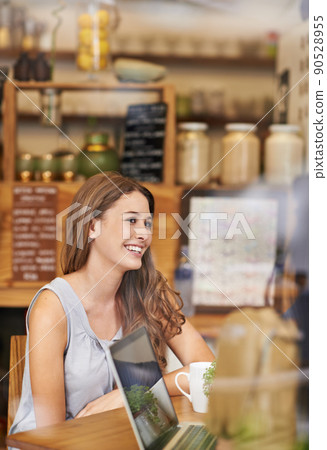 Always great to catch up with old friends. Shot of a two young woman talking in a cafe. 90528955