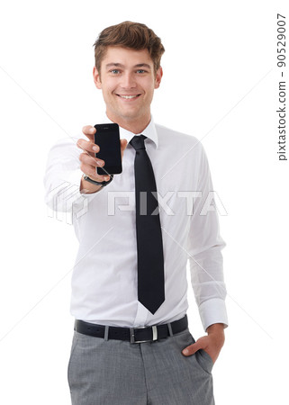 I got your message. Studio portrait of a handsome young business professional displaying a blank cellphone screen to the camera. 90529007