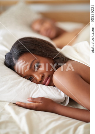 Its morning. Shot of a beautiful young woman in her bedroom. 90529222