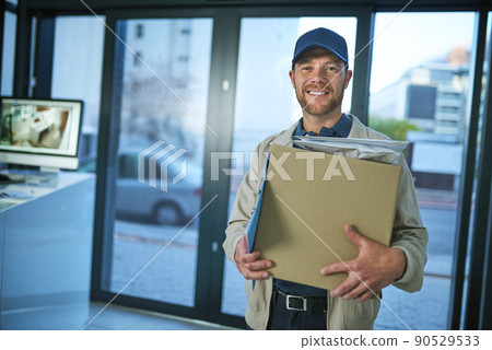 Did someone order a package. Shot of a young man making a home delivery. 90529533