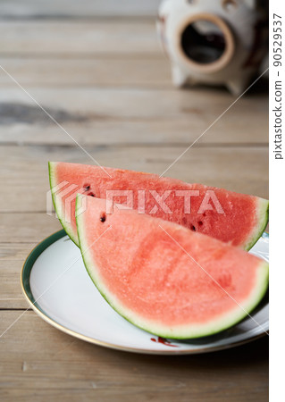 Watermelon placed on the porch 90529537