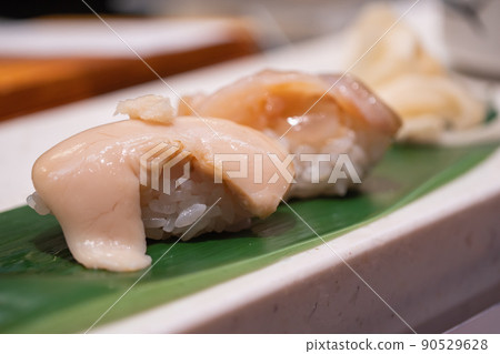 Scallop milt nigiri sushi. 90529628