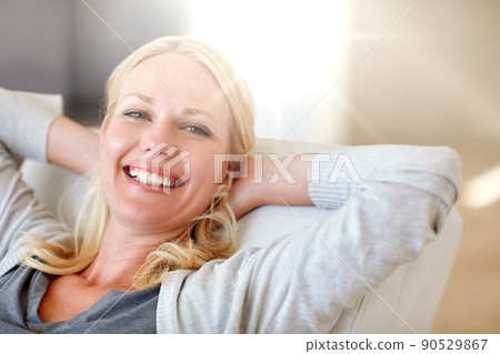 I love a day off. Portrait of a woman relaxing at home. 90529867