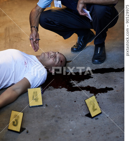Analyzing the crime scene. Shot of a crime scene investigation in progress. 90529975