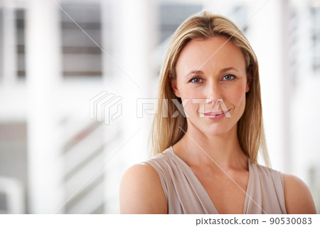 Innovative and ambitious. Portrait of an ambitious businesswoman standing in the office. Innovative and ambitious. Portrait of an ambitious businesswoman standing in the office. 90530083