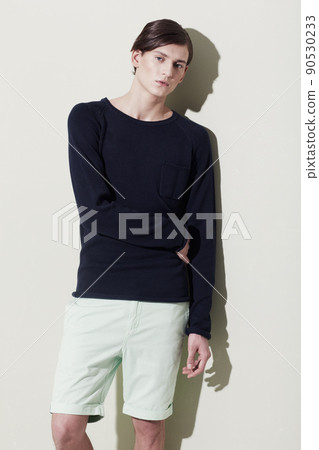 He can pull off any fashion style. A handsome young man with elegant facial features posing for a studio shoot. 90530233