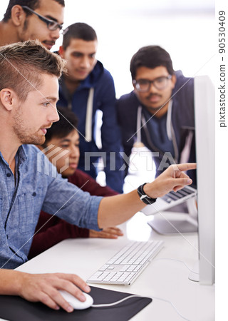 Need solutions This is the team you want supporting you. Shot of a group of colleagues working together with a computer in an office. 90530409