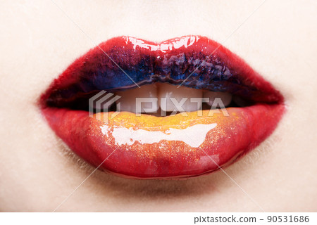 Youll never forget these lips. Cropped shot of a womans multicoloured lips. 90531686