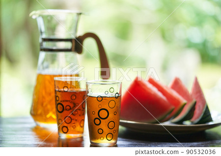 Barley tea and watermelon poured into a glass 90532036