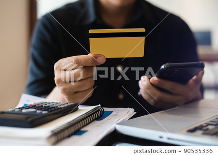 Closeup Men Holding Hand Credit Card.Businessman Use Smartphone Online Payments Shopping.Guy Touching Screen Mobile Phone Name Numbers. 90535336