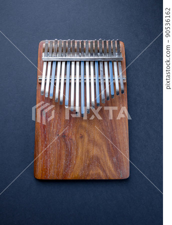 Traditional wooden kalimba isolated on black Traditional wooden kalimba isolated on black 90536162