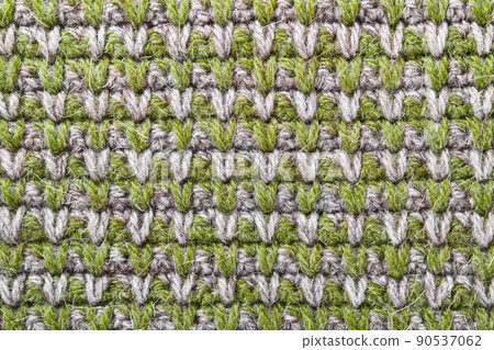Gray green knitting wool texture background. Canvas is crocheted of natural threads in natural colors 90537062
