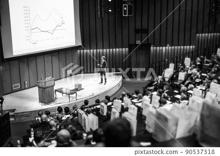 Speaker giving presentation on business conference event. Speaker giving presentation on business conference event. 90537318
