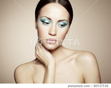 Beautiful young woman with bright make-up Beautiful young woman with bright make-up 90537536