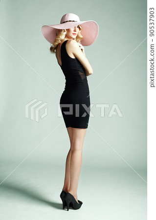 Fashion photo of young magnificent woman in hat. Girl posing Fashion photo of young magnificent woman in hat. Girl posing 90537903