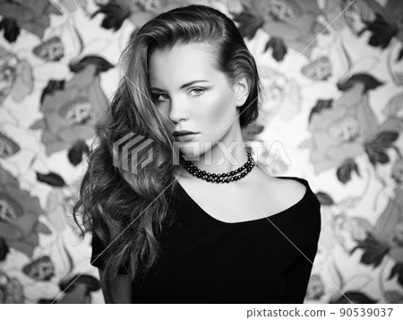 Portrait young beautiful woman with curly hair 90539037