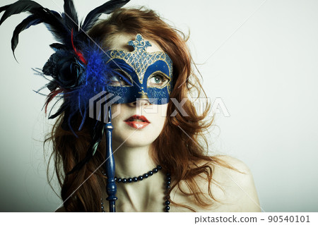 The beautiful young girl in a mysterious mask The beautiful young girl in a mysterious mask 90540101