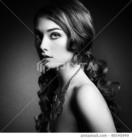 Beauty woman with long curly hair. Beautiful girl with elegant hairstyle 90540949