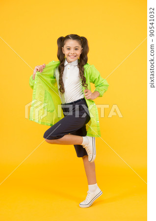 Waterproof concept. Small schoolgirl wear water resistant 90541032