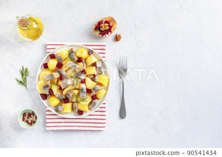 Smoked hering, potato and beetroot salad served with beet caviar toast Smoked hering, potato and beetroot salad served with beet caviar toast 90541434