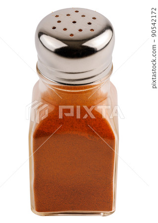 glass pepper pot with ground red paprika pepper isolated on white background 90542172