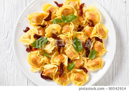 italian Tortelloni stuffed with sun dried tomatoes italian Tortelloni stuffed with sun dried tomatoes 90542914