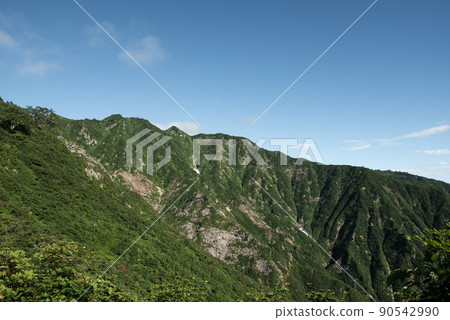 The view from the mountain trail of Kengamine between Mikuni hut of Mt. Iide and Mt. Jizo in the summer of 100 famous mountains in Japan in Kitakata City, Fukushima Prefecture The view from the mountain trail of Kengamine between Mikuni hut of Mt. Iide and Mt. Jizo in the summer of 100 famous mountains in Japan in Kitakata City, Fukushima Prefecture 90542990