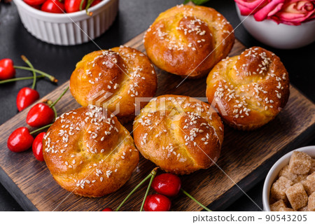 Fresh delicious rice flour muffins with cherries on a concrete background. Homemade pastries Fresh delicious rice flour muffins with cherries on a concrete background. Homemade pastries 90543205