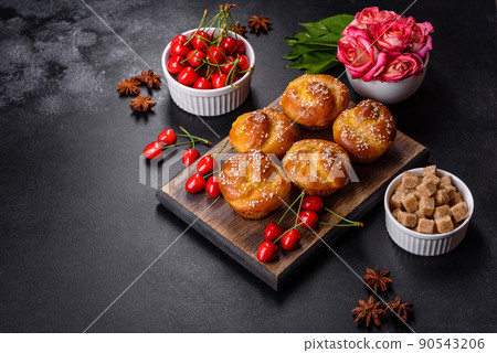 Fresh delicious rice flour muffins with cherries on a concrete background. Homemade pastries Fresh delicious rice flour muffins with cherries on a concrete background. Homemade pastries 90543206
