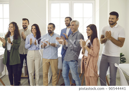 Team of happy and joyful colleagues applauds, expressing their gratitude after a successful meeting. Team of happy and joyful colleagues applauds, expressing their gratitude after a successful meeting. 90544441