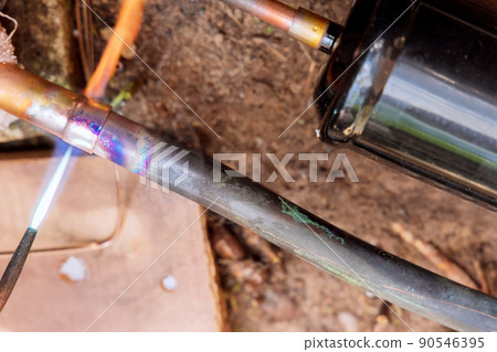 Connecting copper pipe to outside air conditioner unit Connecting copper pipe to outside air conditioner unit 90546395