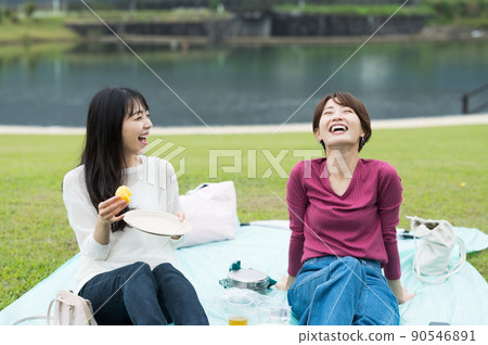 Two women having lunch outdoors Two women having lunch outdoors 90546891