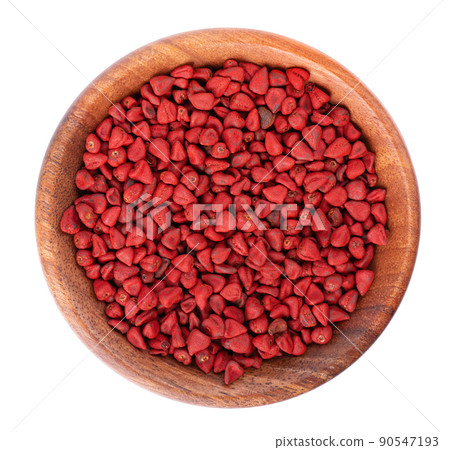 Annatto seeds in wooden bowl, isolated on a white background. Achiote seeds, bixa orellana. Natural dye for cooking and food. Close-up. Top view. Annatto seeds in wooden bowl, isolated on a white background. Achiote seeds, bixa orellana. Natural dye for cooking and food. Close-up. Top view. 90547193