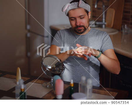 Men's beauty concept. caucAsian guy checking his skin. 90547354