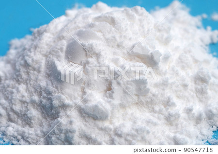 Baking soda on blue background. Baking soda on blue background. 90547718